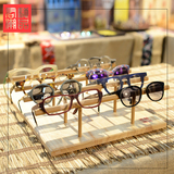 君驰潮品 橱窗展示架 高档实木眼镜摆件 时尚个性眼镜氛围道具