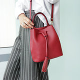 韩国进口正品代购经典设计纯色抽带流苏水桶包手提单肩斜跨女包包