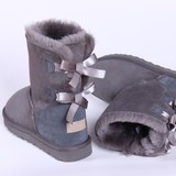 特价3280羊皮毛一体中筒雪地靴 蝴蝶结冬季保暖女鞋子靴子 促销