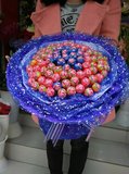 郑州鲜花同城速递金水区实体花店求婚生日鲜花速递99支棒棒糖花束
