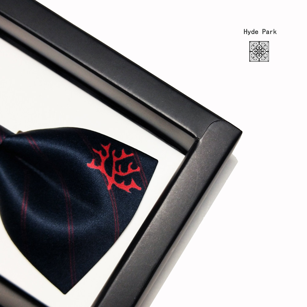 Hyde Parks original red-and-blue coral striped suit is dressed in a wedding grooms grooms mens bow tie